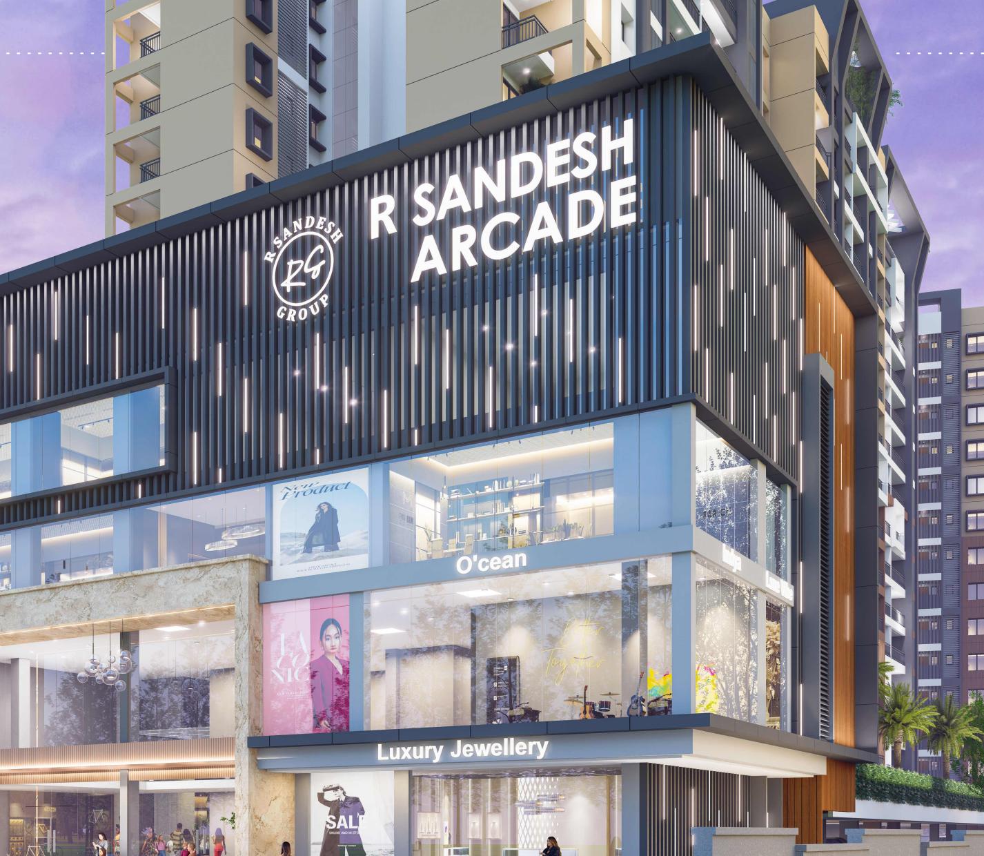 R Sandesh Arcade storefronts at dusk